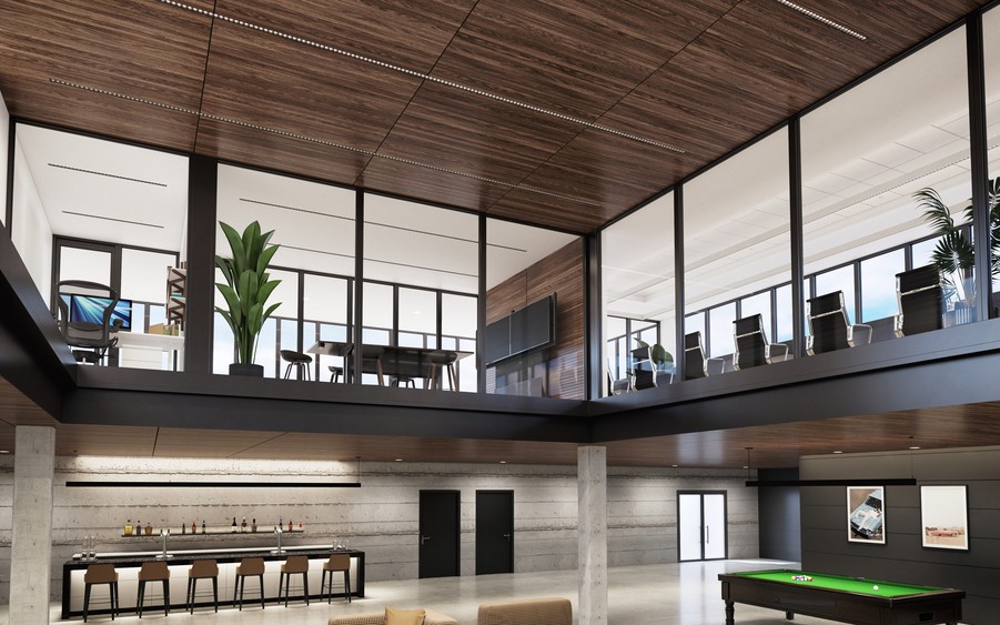 A modern office with a pool table and bar downstairs and conference rooms with displays upstairs.
