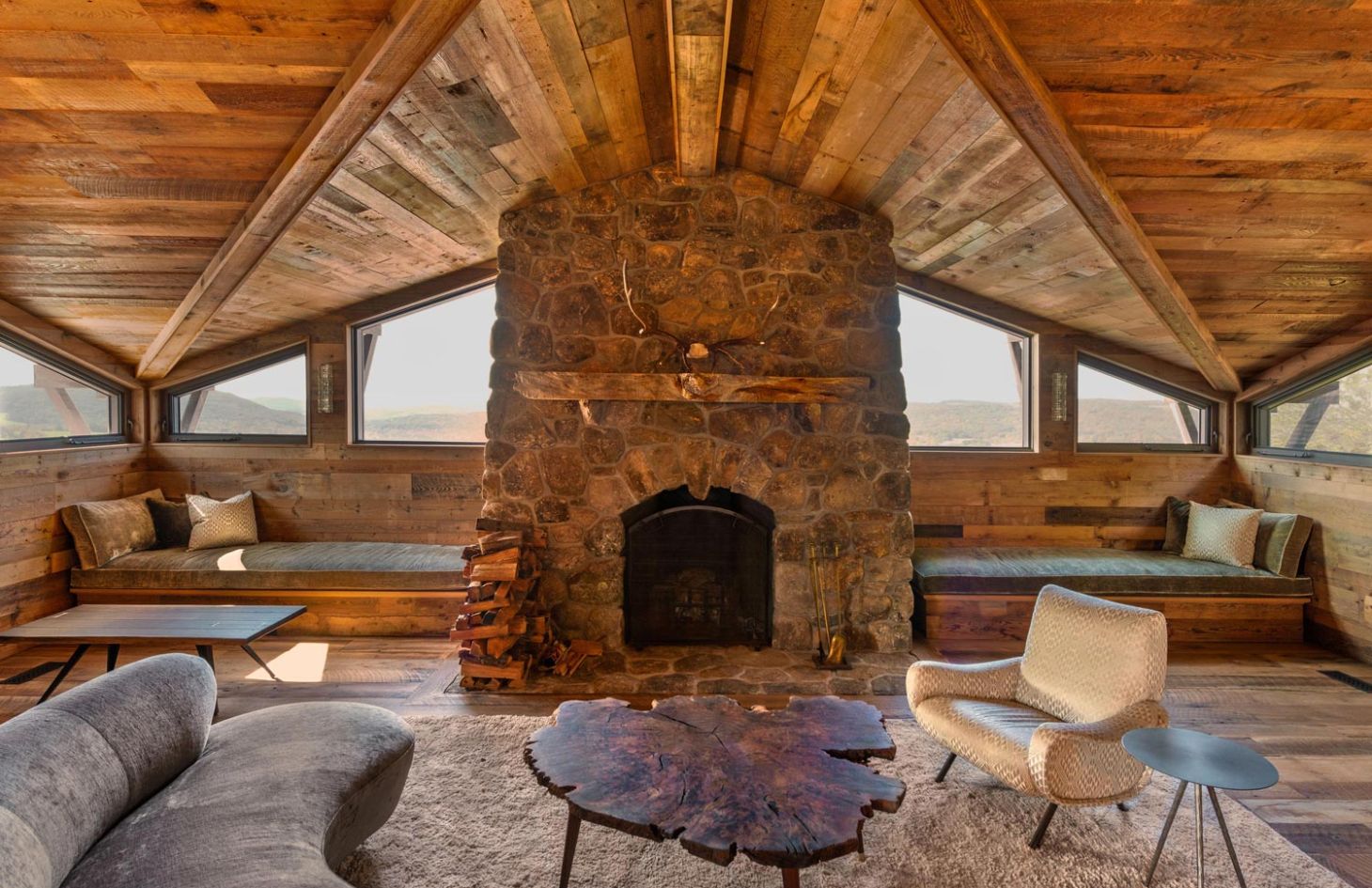 Living room by the fireplace in a lodge